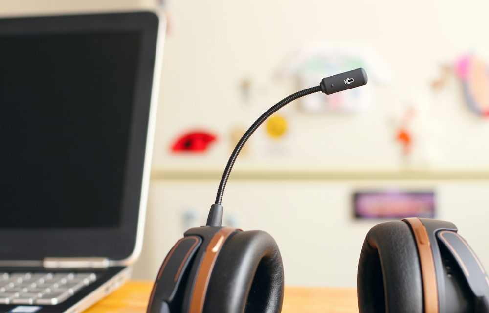 Support agent wearing a headset at a desk