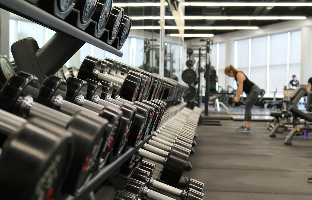 Modern gym floor with fitness equipment