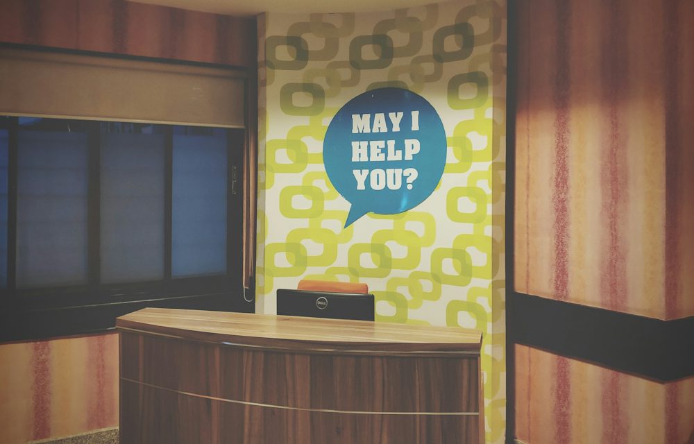 Reception desk in a bright office lobby