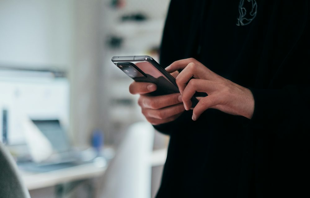 Person sending messages on a smartphone